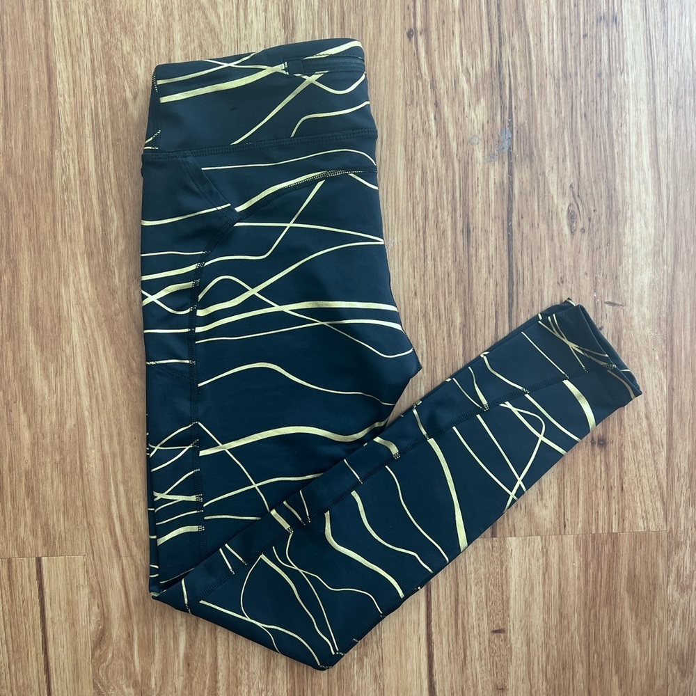Nike Athletic leggings - black and gold